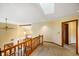 Upstairs hallway featuring skylight, railing, carpet, and natural light at 2508 Indian Creek Rd, Trafalgar, IN 46181