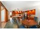 Open kitchen with tile flooring and updated stainless steel appliances next to breakfast table at 2508 Indian Creek Rd, Trafalgar, IN 46181