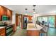 Kitchen features a center island, stainless steel appliances, and tile flooring at 2508 Indian Creek Rd, Trafalgar, IN 46181