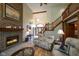 Inviting living room boasting a fireplace, staircase, and natural light at 2508 Indian Creek Rd, Trafalgar, IN 46181