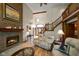 Spacious living room featuring fireplace, hardwood floors, and view into foyer at 2508 Indian Creek Rd, Trafalgar, IN 46181