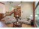 Spacious living room with hardwood floors, comfortable seating, and large windows at 2508 Indian Creek Rd, Trafalgar, IN 46181