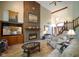 Cozy living room featuring a fireplace, wood floors, and comfortable seating at 2508 Indian Creek Rd, Trafalgar, IN 46181