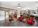 The recreation room has two sitting areas, framed wall art, and recessed lighting at 2508 Indian Creek Rd, Trafalgar, IN 46181