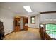 Upstairs hallway with carpet, skylight and built in shelving overlooking the living room at 2508 Indian Creek Rd, Trafalgar, IN 46181