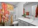 Bright bathroom boasts a shower-tub combination and a stylish vanity with a large mirror at 2542 Barstow Dr, Whitestown, IN 46075