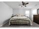 Inviting bedroom with a ceiling fan, comfortable bed, and neutral decor offers a relaxing retreat at 2542 Barstow Dr, Whitestown, IN 46075