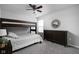 Comfortable bedroom includes a bunk bed, ceiling fan, and a dresser for ample storage at 2542 Barstow Dr, Whitestown, IN 46075