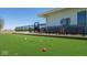 Well-maintained bocce ball court with colorful balls and comfortable seating in a community setting at 2542 Barstow Dr, Whitestown, IN 46075