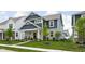 Inviting two-story home showcasing blue siding and stone details in a suburban setting at 2542 Barstow Dr, Whitestown, IN 46075