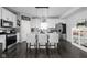 Modern kitchen with white cabinets, stainless steel appliances, and a breakfast bar at 2542 Barstow Dr, Whitestown, IN 46075