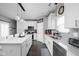 Bright kitchen features a large island, stainless steel appliances, and white cabinetry at 2542 Barstow Dr, Whitestown, IN 46075