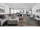 Open-concept living room with hardwood floors and a large sectional sofa at 2542 Barstow Dr, Whitestown, IN 46075