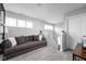 Cozy living room area features ample natural light and a comfortable seating arrangement at 2542 Barstow Dr, Whitestown, IN 46075