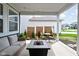 Inviting patio with comfortable seating, a fire pit, and a landscaped yard at 2542 Barstow Dr, Whitestown, IN 46075