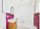 Compact bathroom featuring a vanity, bathtub, and unique tiling, ideal for renovation projects at 29 E Pine St, Anderson, IN 46012