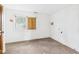 Basic bedroom with worn carpet and boarded window, ready for complete remodeling at 29 E Pine St, Anderson, IN 46012