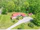 Beautiful property featuring a red roof, ample green space, an outbuilding, and convenient covered parking at 295 Maple Turn Rd, Martinsville, IN 46151