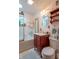 Bathroom featuring a wood vanity, a decorative mirror, a bathtub, and a shower at 295 Maple Turn Rd, Martinsville, IN 46151