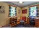 Bedroom features hardwood floors, two windows with wood trim, and neutral-colored walls and ceilings at 295 Maple Turn Rd, Martinsville, IN 46151