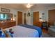 Comfortable bedroom with wooden dresser and decor; ceiling fan and natural light at 295 Maple Turn Rd, Martinsville, IN 46151