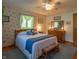 Charming bedroom with natural light, ceiling fan and a serene atmosphere at 295 Maple Turn Rd, Martinsville, IN 46151