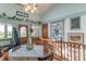 Bright dining area featuring a round table, natural lighting, access to front door, and decorative accents at 295 Maple Turn Rd, Martinsville, IN 46151
