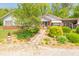 Beautiful home with a red roof, stone pathway, and mature landscaping, with lots of curb appeal at 295 Maple Turn Rd, Martinsville, IN 46151
