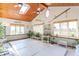 Bright indoor pool area featuring skylights, plants, comfortable seating, and lots of windows at 295 Maple Turn Rd, Martinsville, IN 46151