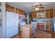 Functional kitchen features light oak cabinetry, matching island, and adjacent breakfast nook for casual dining at 295 Maple Turn Rd, Martinsville, IN 46151