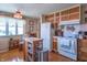 Well-lit kitchen with wood floors, white appliances, and ample cabinet space for storage at 295 Maple Turn Rd, Martinsville, IN 46151