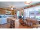 Bright kitchen featuring wood cabinets, an island, and a cozy breakfast nook with natural light at 295 Maple Turn Rd, Martinsville, IN 46151