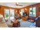 Cozy living room with wood paneled walls, lots of windows, comfortable seating, and natural light at 295 Maple Turn Rd, Martinsville, IN 46151