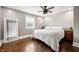 Bright bedroom with hardwood floors, ceiling fan and a comfortable queen bed at 3019 W Huntsville Rd, Pendleton, IN 46064