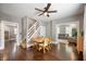 Elegant dining room with a round table, hardwood floors, and a view of the staircase and living area at 3019 W Huntsville Rd, Pendleton, IN 46064