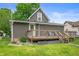 Charming home featuring wooden deck and green lawn at 3019 W Huntsville Rd, Pendleton, IN 46064