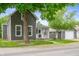 Charming two-story home with gray siding and a detached garage, surrounded by green trees and grass at 3019 W Huntsville Rd, Pendleton, IN 46064