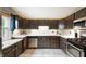Modern kitchen with sleek cabinets, quartz countertops, and stainless steel appliances, perfect for cooking at 3019 W Huntsville Rd, Pendleton, IN 46064