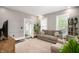 Bright living room with hardwood floors, neutral decor, and ample natural light, creating a cozy atmosphere at 3019 W Huntsville Rd, Pendleton, IN 46064