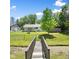 Picturesque backyard featuring footbridge, mature trees and large open area at 3022 Cameron St, Indianapolis, IN 46203