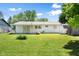 Large backyard features lush lawn, mature trees, and a storage shed at 3022 Cameron St, Indianapolis, IN 46203