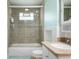 Bathroom with a shower-tub combo and tile surround, complete with glass shower doors at 3022 Cameron St, Indianapolis, IN 46203