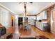 Open kitchen with an island, stainless appliances and brick accent wall at 3022 Cameron St, Indianapolis, IN 46203