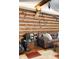 Living room showing leather sofa, wood paneled walls, and vintage wall decor at 3022 Cameron St, Indianapolis, IN 46203