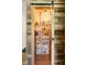 Well-organized walk-in pantry features sliding barn door and ample shelving for optimal kitchen storage at 3022 Cameron St, Indianapolis, IN 46203