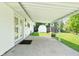Spacious covered patio leading to a well-maintained backyard with a storage shed at 3022 Cameron St, Indianapolis, IN 46203