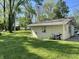 View of backyard with shed and lawn, perfect for quiet outdoor activities at 3081 Woodridge Rd, Shelbyville, IN 46176