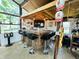 Charming bar area with stools, perfect for relaxing and watching TV with friends and Gathering at 3081 Woodridge Rd, Shelbyville, IN 46176