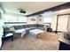 Cozy living room with a large sectional sofa, carpeted floor, and recessed lighting at 3081 Woodridge Rd, Shelbyville, IN 46176