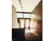 Stairs leading down, wood paneling on the walls, and a view of the outside at 3081 Woodridge Rd, Shelbyville, IN 46176